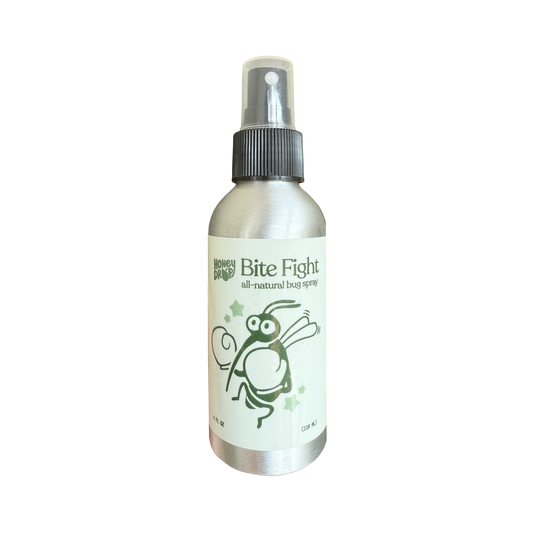 A silver metal spray bottle with a black spray cap and a white label featuring a green cartoon bug illustration and the text 'Bite Fight' and 'all-natural bug spray'.