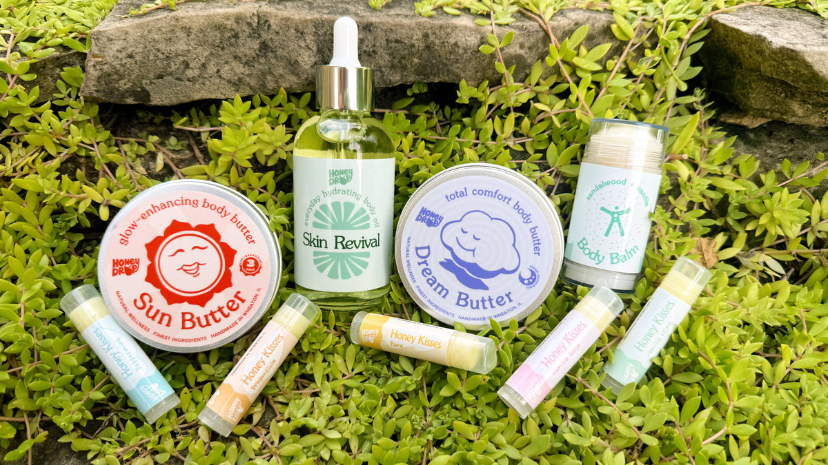 honeydrop products sit on a rock covered with vibrant green moss