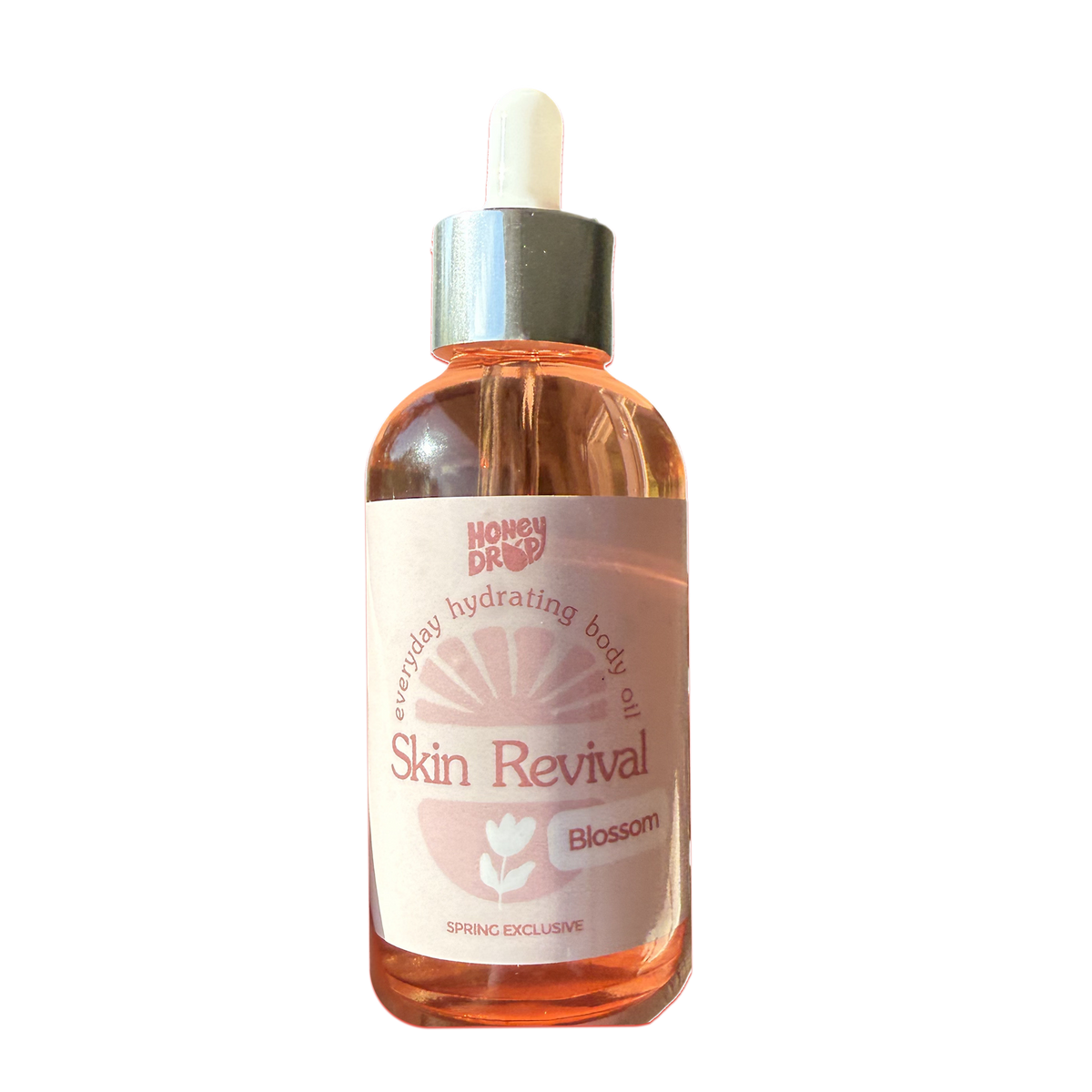 A bottle of Honey Dr. Skin Revival Blossom body oil with a dropper cap, filled with pinkish-orange liquid, on a plain white background.